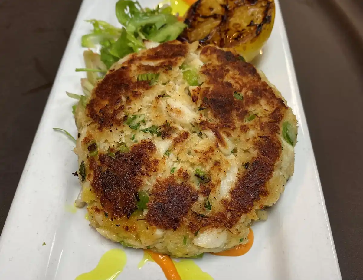 A crab cake plated at CHAR Grillhouse