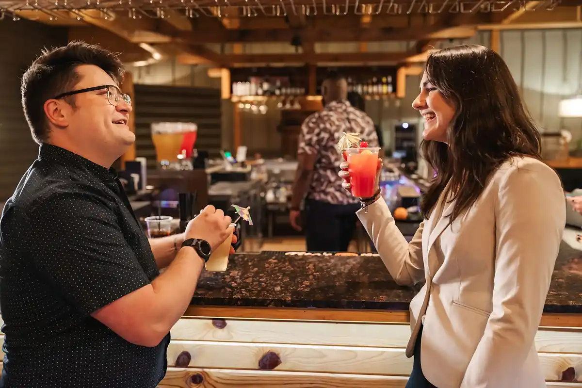 Friends laughing at the bar