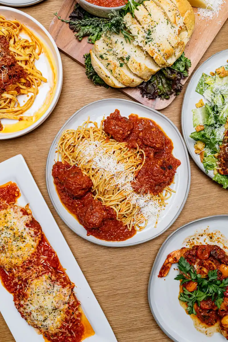 Spaghetti and meatballs with other pasta dishes on a table at Jasper’s