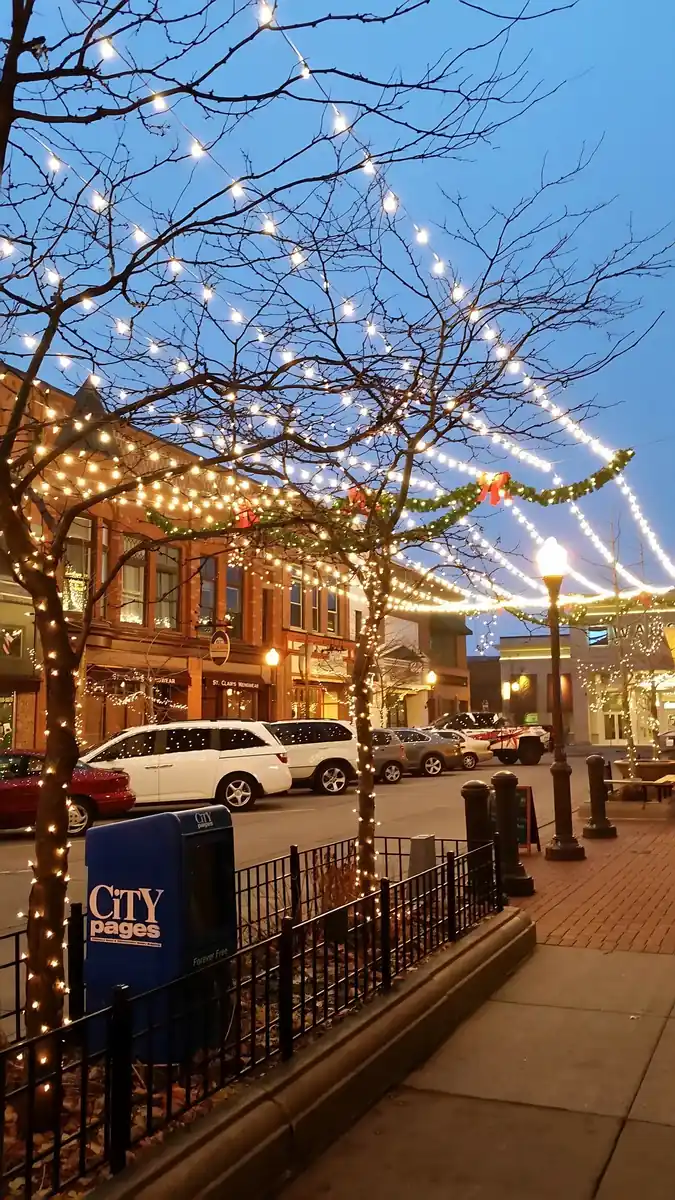 String lights over a downtown Wausau street at night