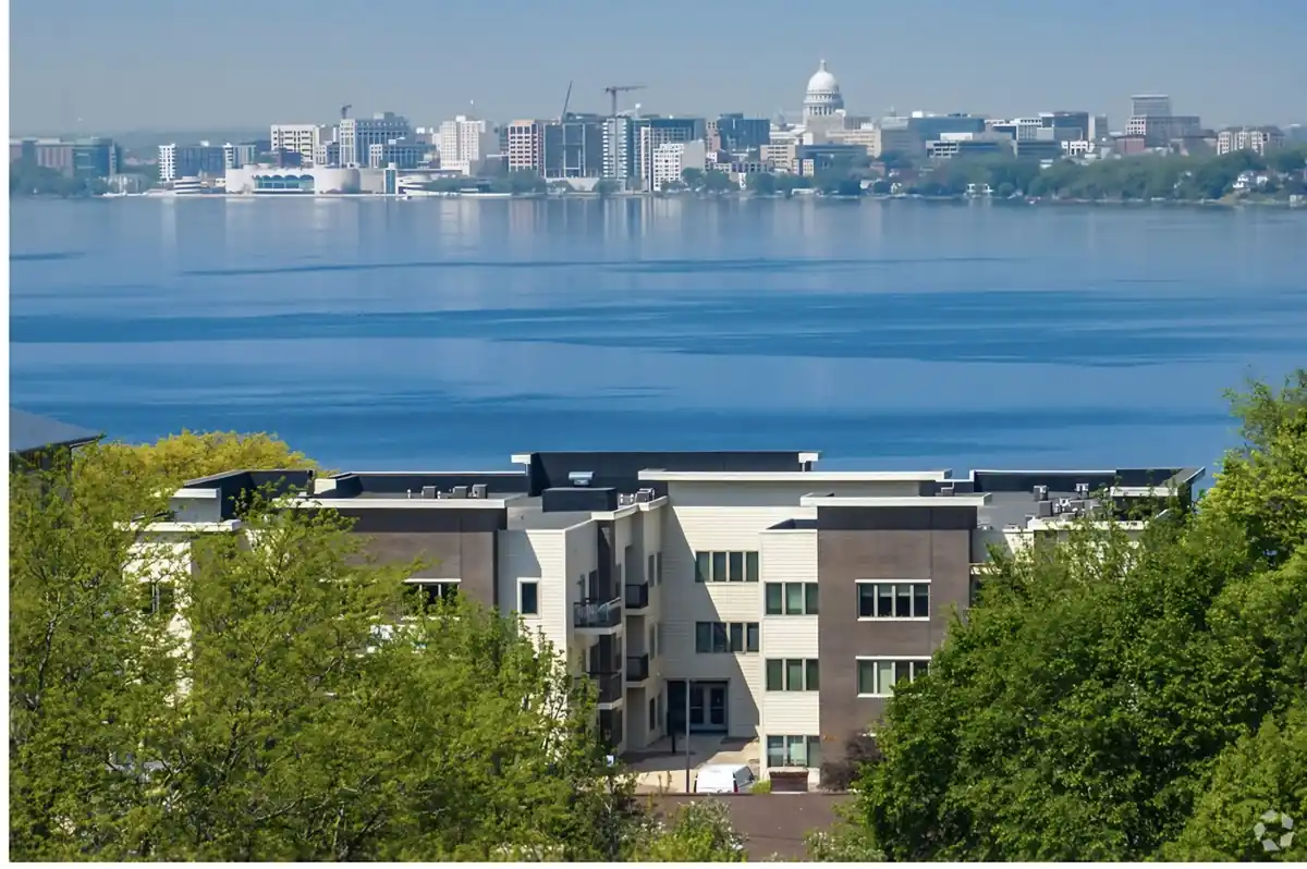 Lake Edge apartments with Lake Monona and the Madison skyline behind